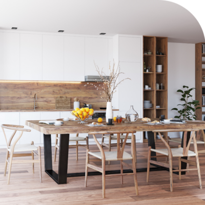 Kitchen with a natural wood table and white cabinets.