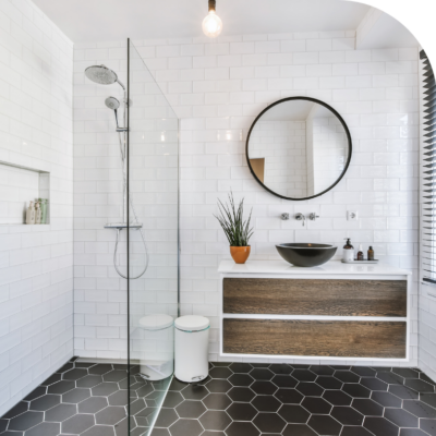 Bathroom with a glass shower and a vanity.